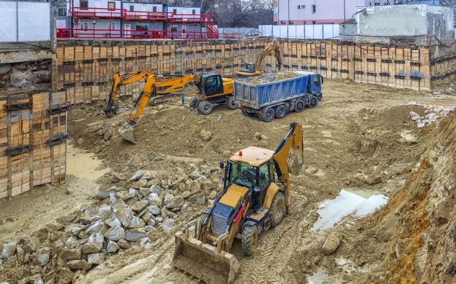 Excavator grading a building site